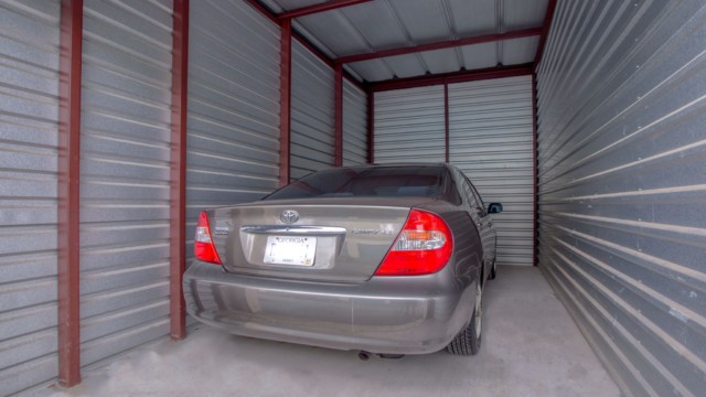 storage unit with a car parked in it.